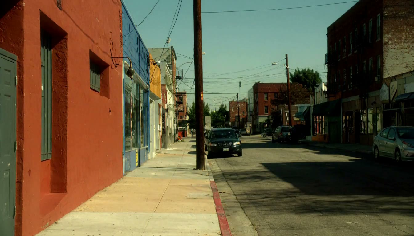MiniMax H3 AI video example showing a person walking down a street while drinking coffee and wearing headphones, transitioning into a muscular figure roaring and flexing in the same location